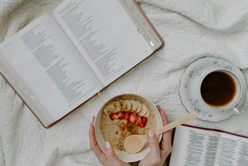 A serene morning setup with a Bible, coffee, and oatmeal for reflective study.